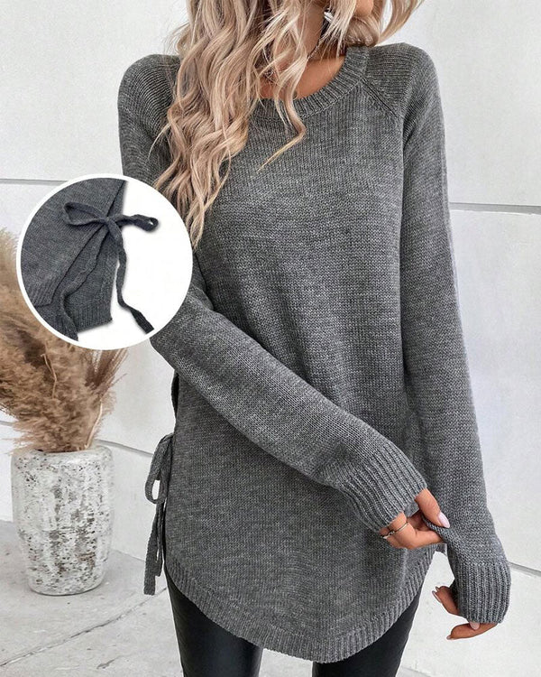 Pulover z raglan rokavi in vozlom ob strani