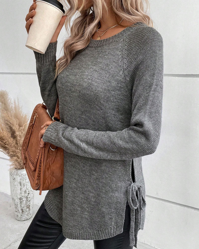 Pulover z raglan rokavi in vozlom ob strani