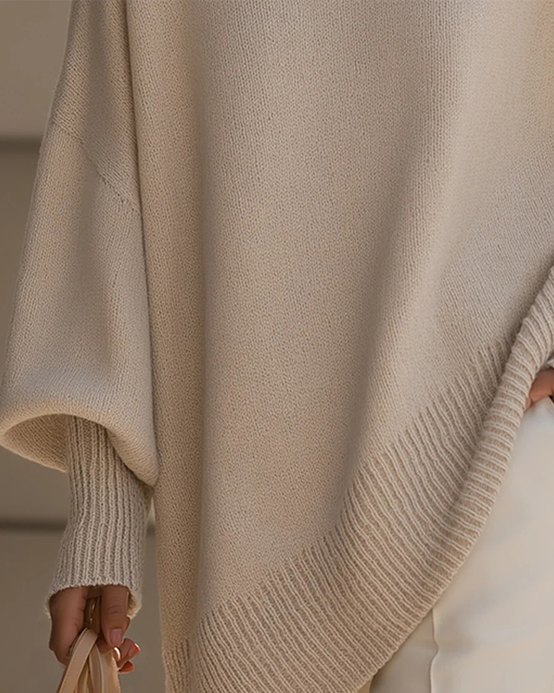 Ohlapen daljši pulover z okroglim izrezom