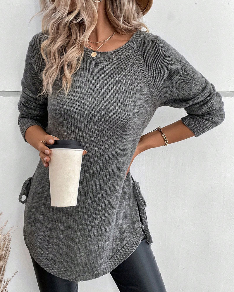Pulover z raglan rokavi in vozlom ob strani