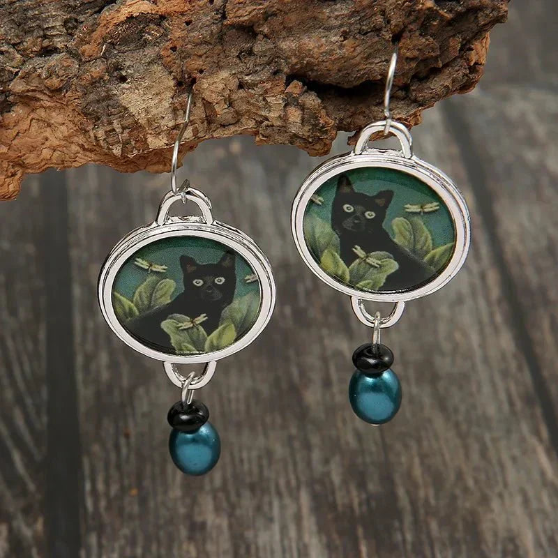 Célia | Brincos Gato Preto Tropical