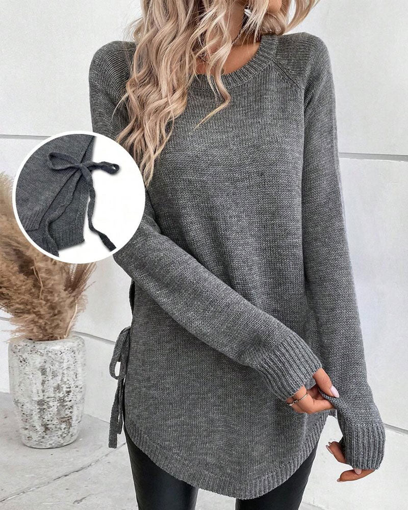 Pulover z raglan rokavi in vozlom ob strani