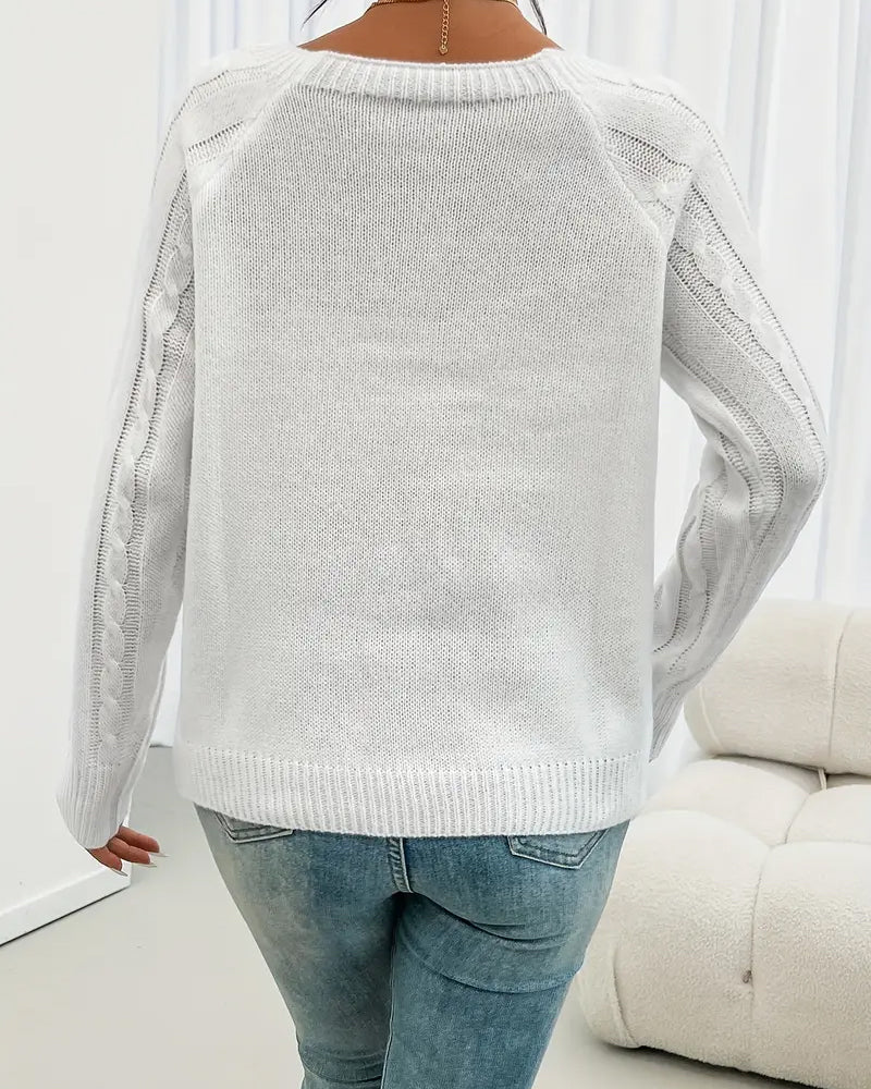 Enobarvni pulover z raglan rokavi in kitastim vzorcem