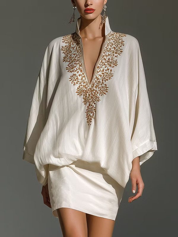 Eleganten dvodelni komplet, bluza in belo mini krilo