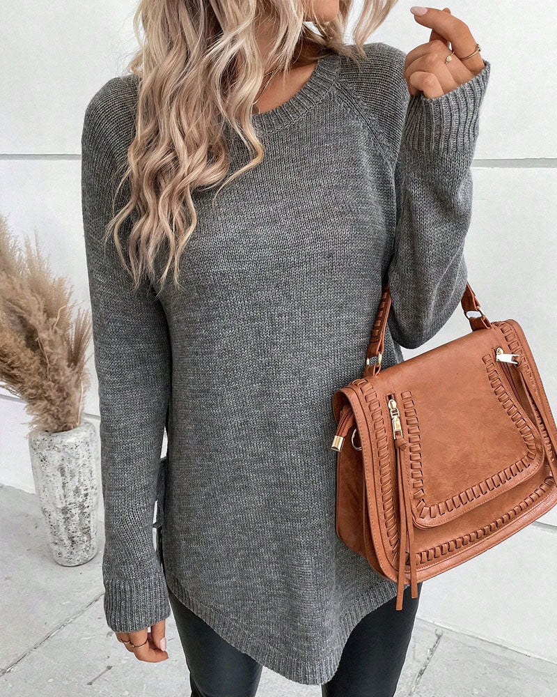 Pulover z raglan rokavi in vozlom ob strani