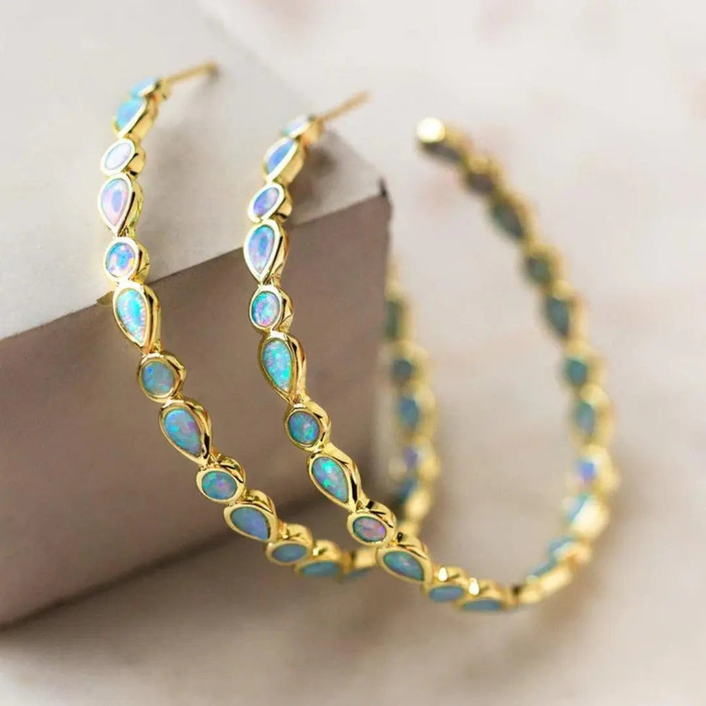 Vintage Ohrringe aus Gold mit blauem Opal