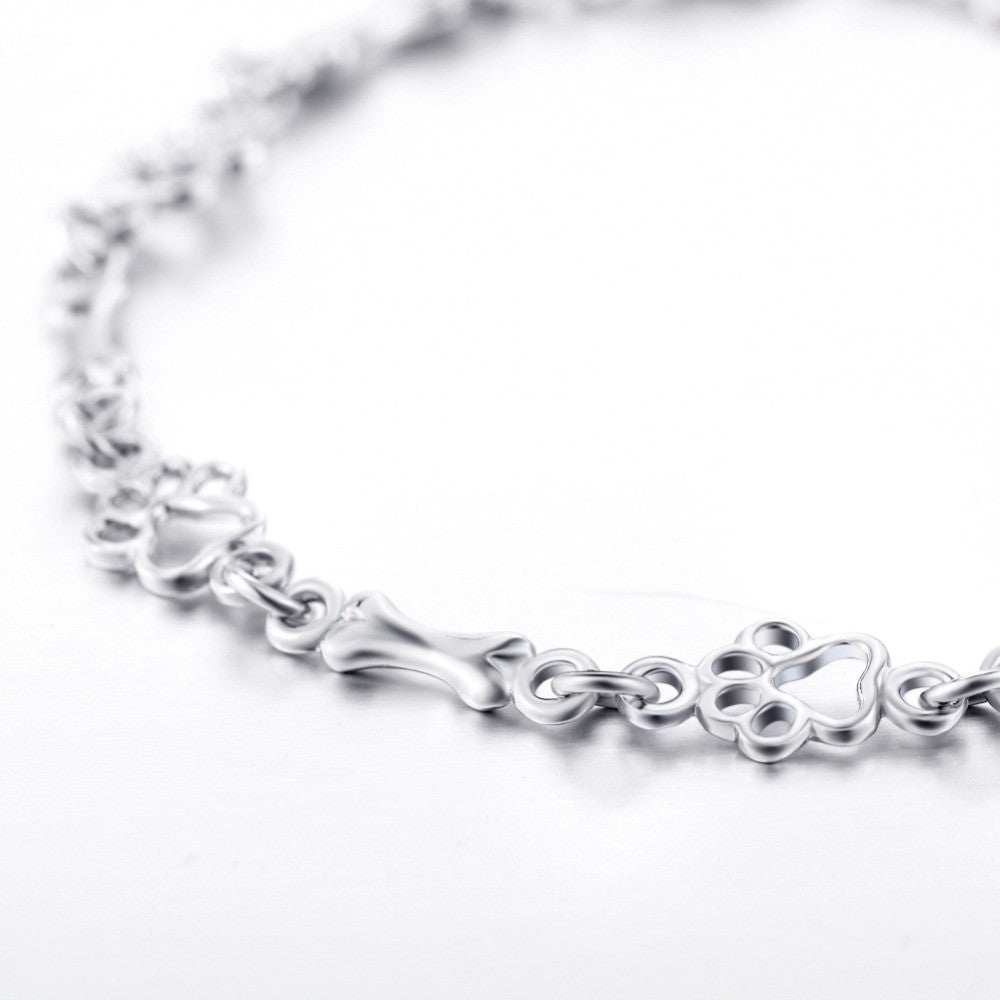 Hundepfote und Knochen Armband in reinem Silber