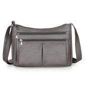 Hladká crossbody kabelka s viacerými vreckami